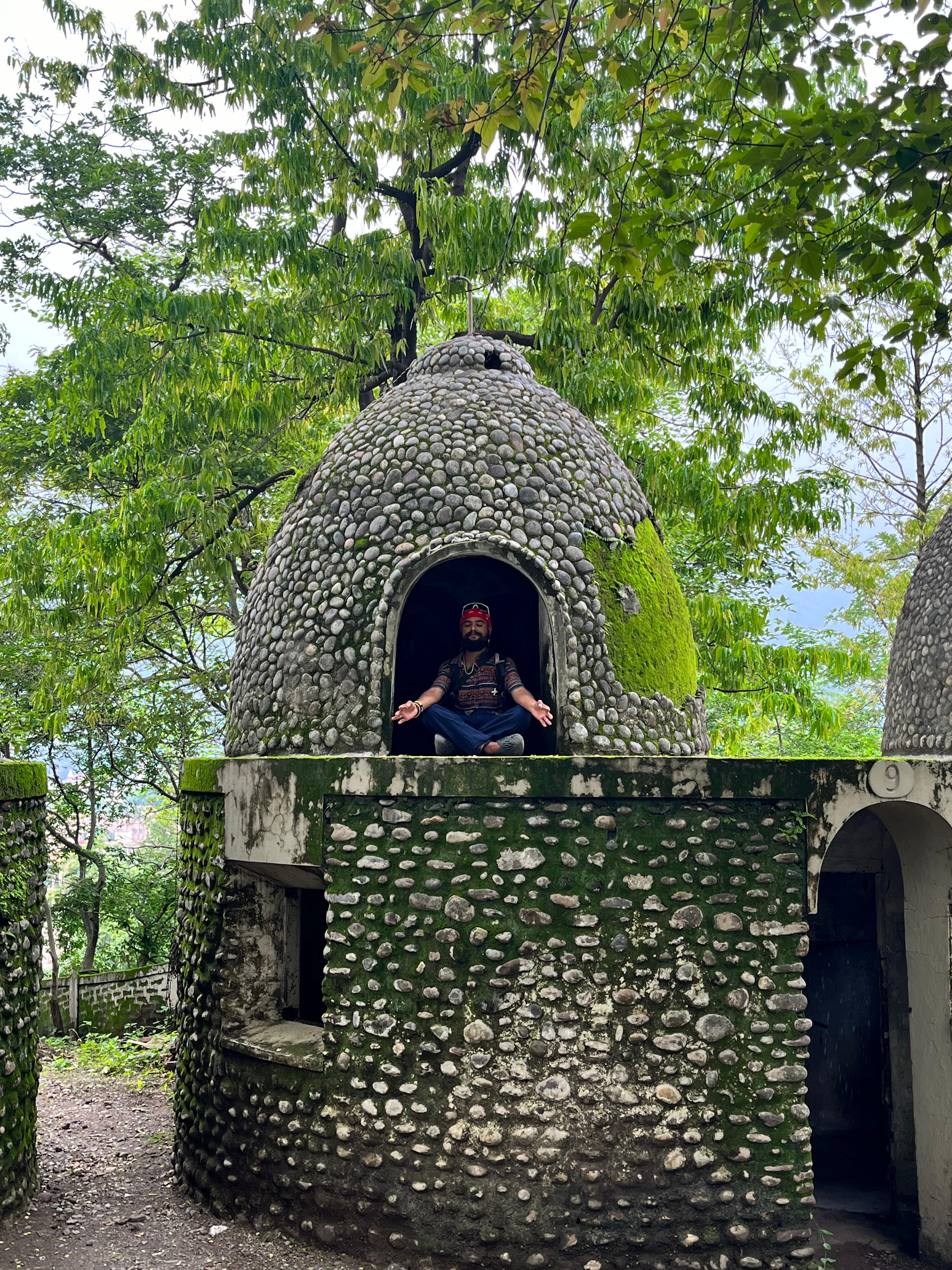 Divyesh meditating in a stone dome